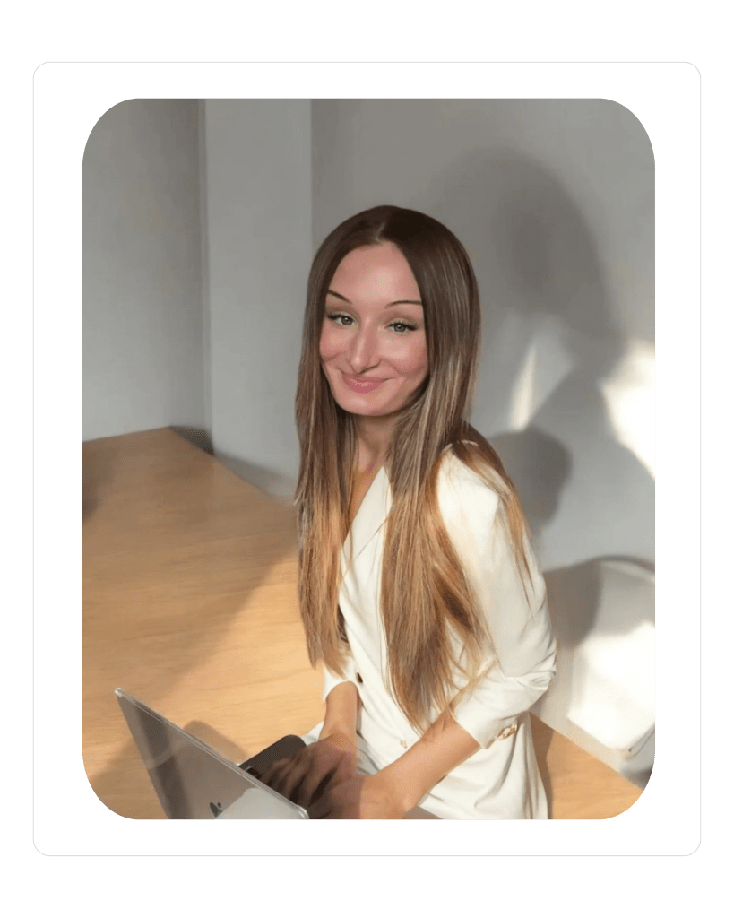 Elizabeth McCuan, founder of Media By Liz (MBL Marketing), sitting at her desk working on digital marketing and website design projects.